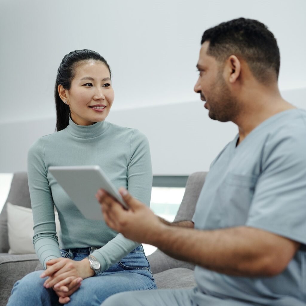 a man and woman sitting on a couch
